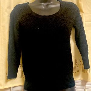 Delia,s black knit sweater with open back with bow